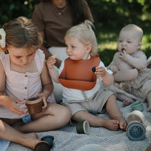 Load image into Gallery viewer, Mushie Silicone Baby Bib | Clay