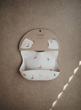Load image into Gallery viewer, Mushie Silicone Baby Bib | Dinosaurs