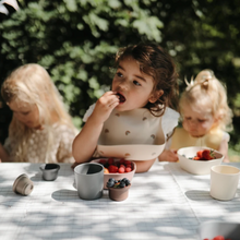 Load image into Gallery viewer, Mushie Silicone Baby Bib | Rainbow