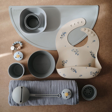 Load image into Gallery viewer, Mushie Silicone Baby Bib | Lilac Flowers