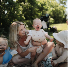 Load image into Gallery viewer, Mushie Silicone Baby Bib | Rainbow