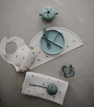 Load image into Gallery viewer, Mushie Silicone Baby Bib | Dinosaurs