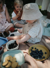 Load image into Gallery viewer, Mushie Silicone Baby Bib | Rainbow