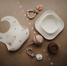 Load image into Gallery viewer, Mushie Silicone Baby Bib | Rainbow