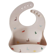 Load image into Gallery viewer, Mushie Silicone Baby Bib | Dinosaurs
